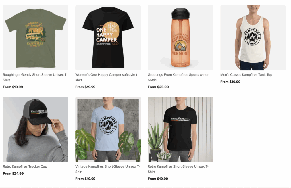 A grid of six products featuring camping-themed apparel and gear: various unisex t-shirts, a women’s t-shirt, a tank top, a trucker hat, and a sports water bottle, all with outdoor or Kampfires graphics and text. Prices range from $19.99 to $25.